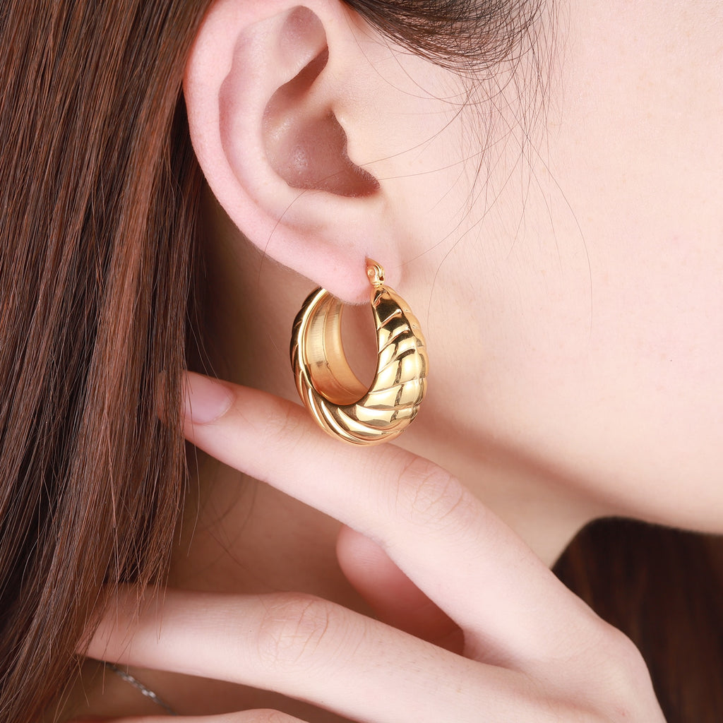 Glamorous Caitlyn Retro Hoop Earrings in gold with intricate detailing. Elevate your outfit with these statement hoops.