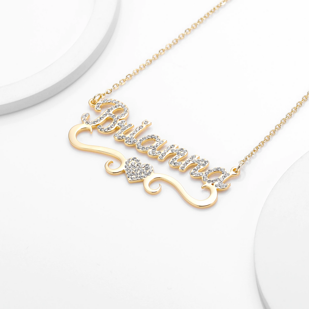 Personalized name necklace with diamond heart pendant.