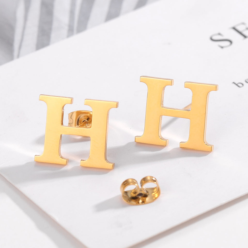 Letter stud earrings in a classic font design, perfect for everyday wear and personalizing your look