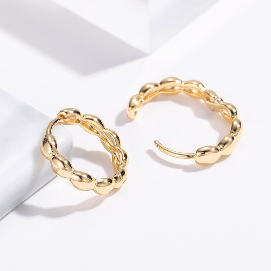 Matilda Retro Hoop Earrings in Gold with intricate detailing and secure latch closure.