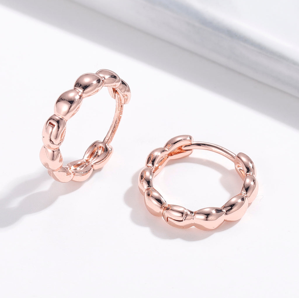 Matilda Retro Hoop Earrings in Rose Gold with intricate detailing and secure latch closure.