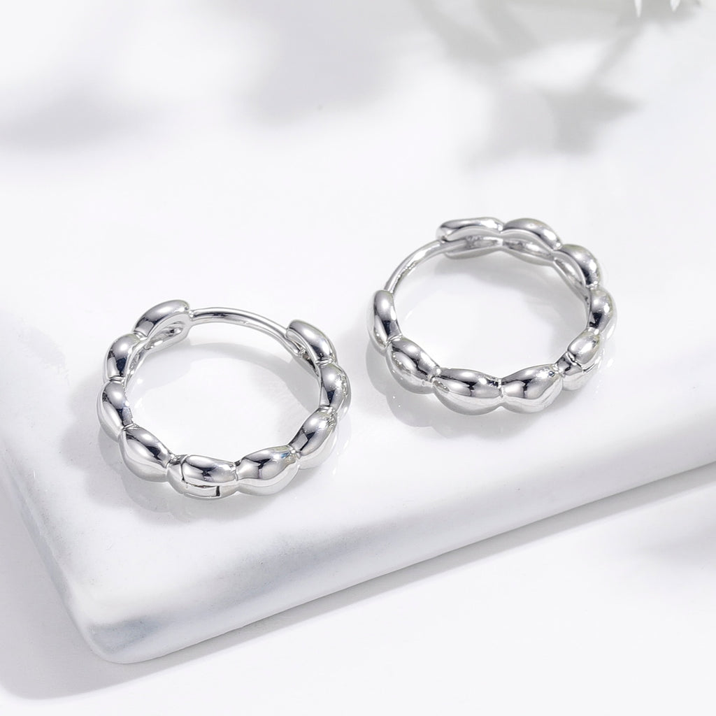 Matilda Retro Hoop Earrings in Silver with intricate detailing and secure latch closure.