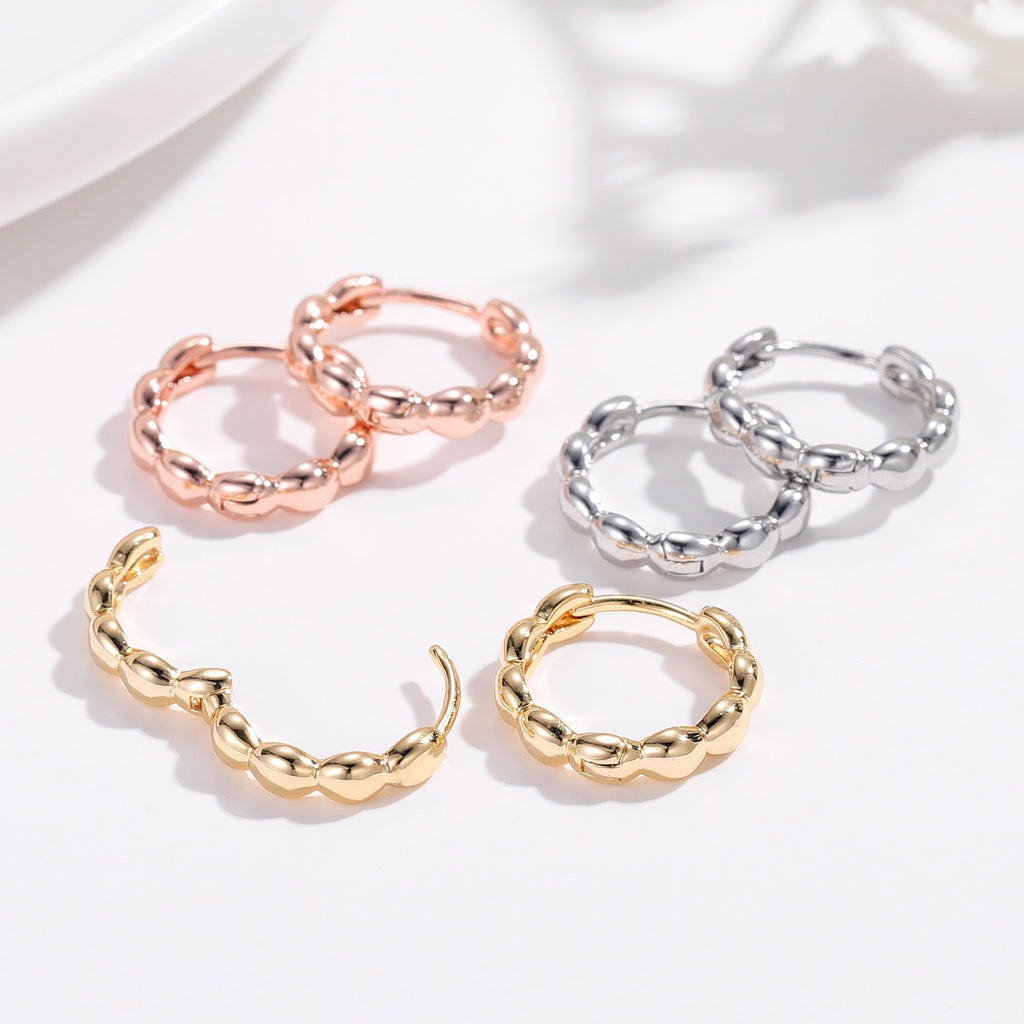 Matilda Retro Hoop Earrings with intricate detailing and secure latch closure.